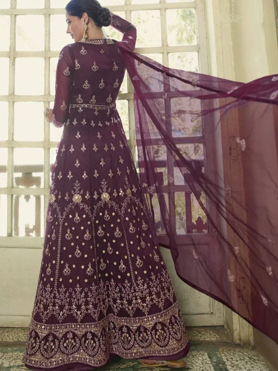 Elegant maroon embroidered anarkali with gold detailing and flowing dupatta, perfect for Indian ethnic occasions