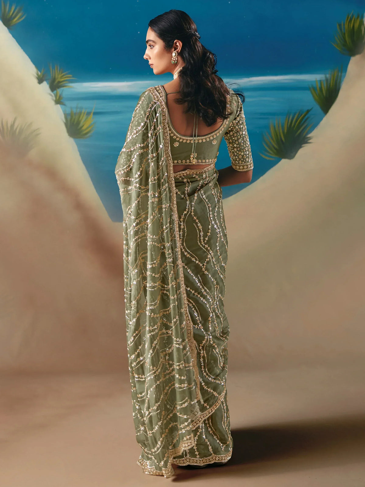 Olive green embroidered saree with gold detailing, perfect for Indian ethnic wear occasions