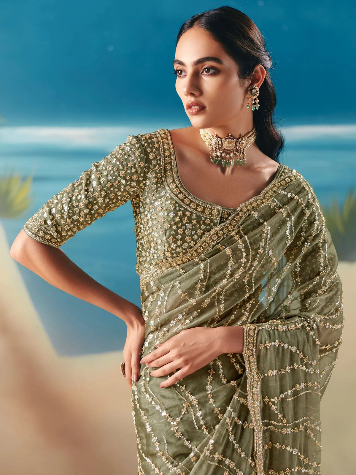 Olive green designer saree with gold sequin embroidery, perfect for Indian ethnic wear occasions
