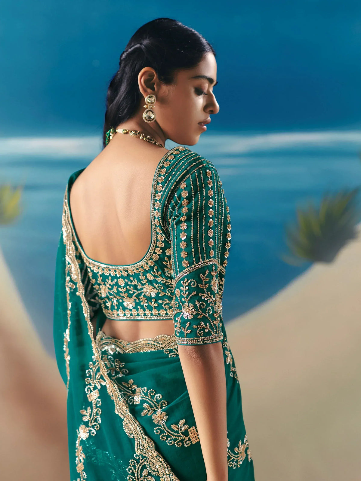 Emerald green designer saree with gold embroidery, backless blouse, perfect for Indian ethnic occasions