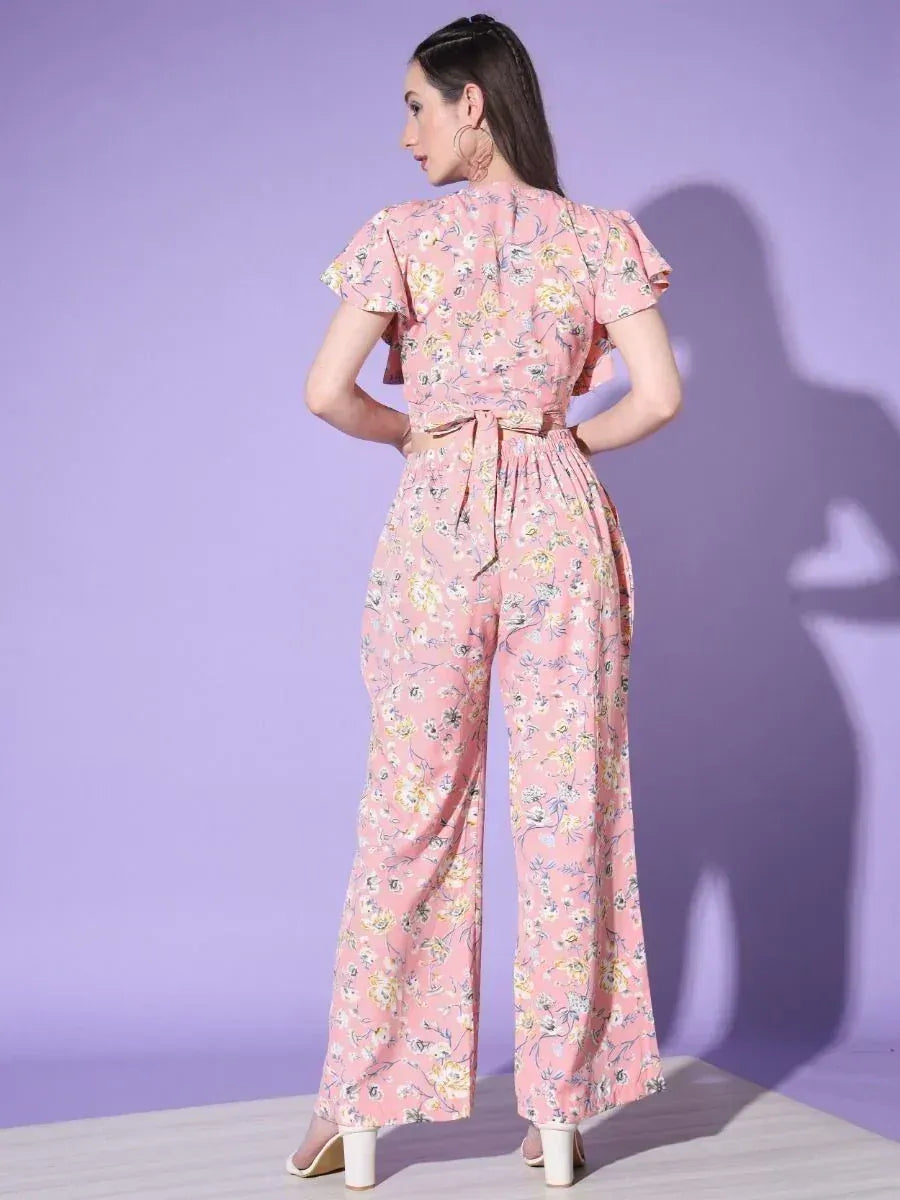 Pink floral print ethnic jumpsuit with ruffle sleeves and tie waist, perfect for casual occasions