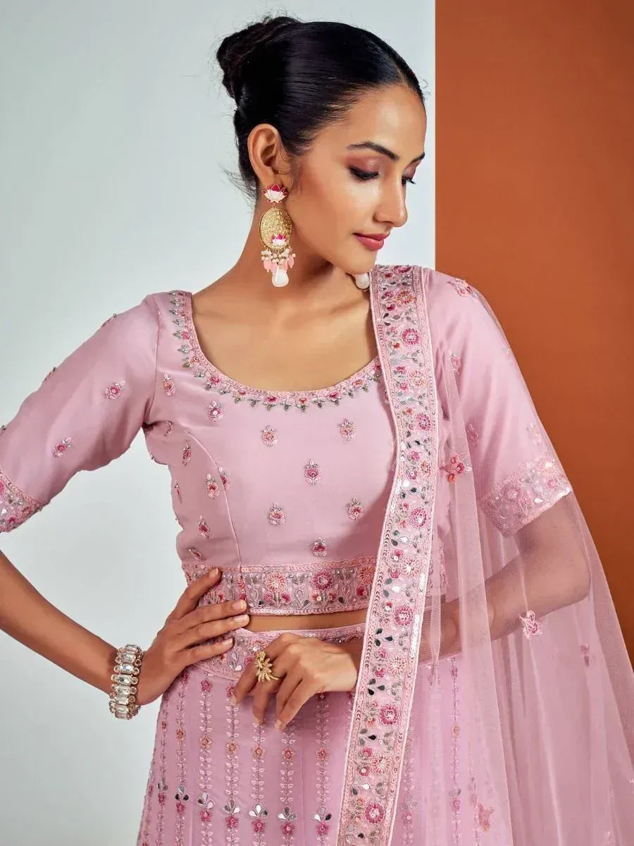Pink embroidered designer lehenga choli with floral motifs and matching dupatta, ideal for Indian ethnic occasions