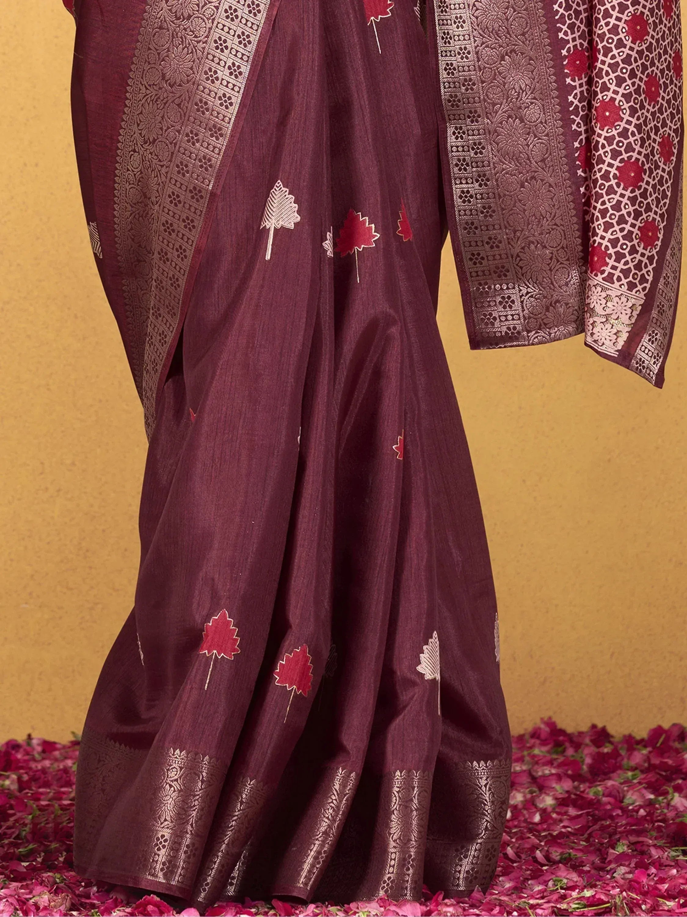 Maroon saree with leaf embroidery and gold border, ethnic Indian wear for festive occasions