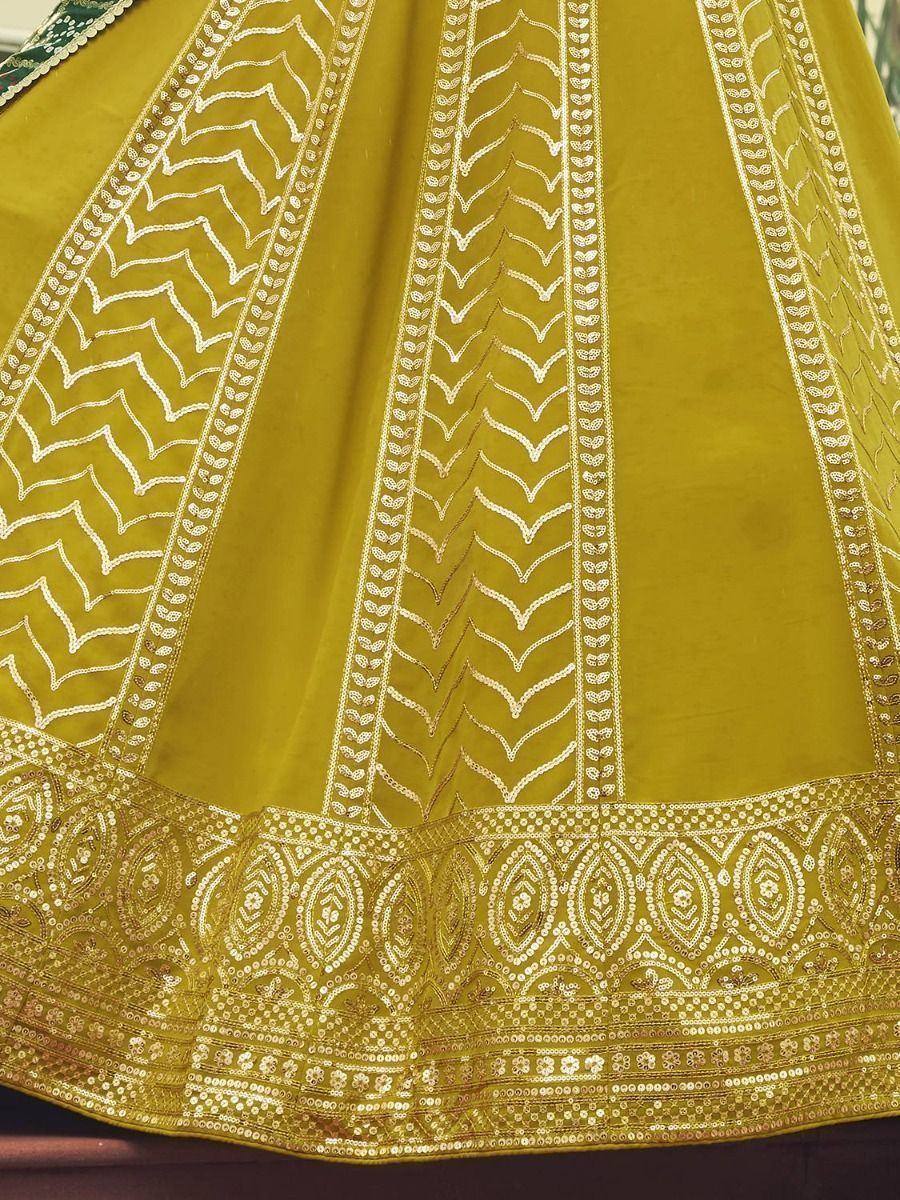 Yellow lehenga with intricate white and gold embroidery, perfect for Indian ethnic wear