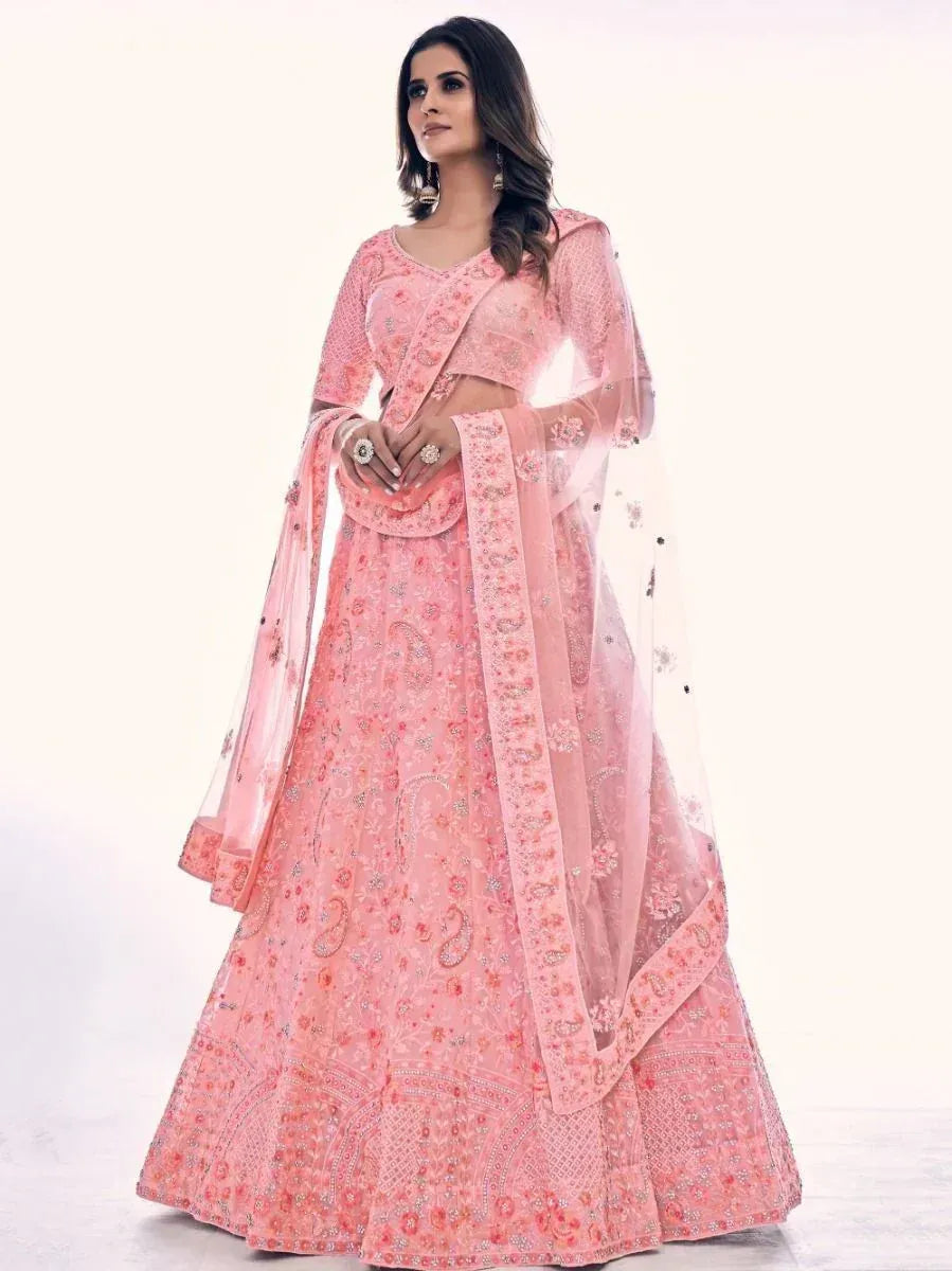 Pink embroidered lehenga choli with floral motifs and sheer dupatta, ideal for Indian ethnic occasions