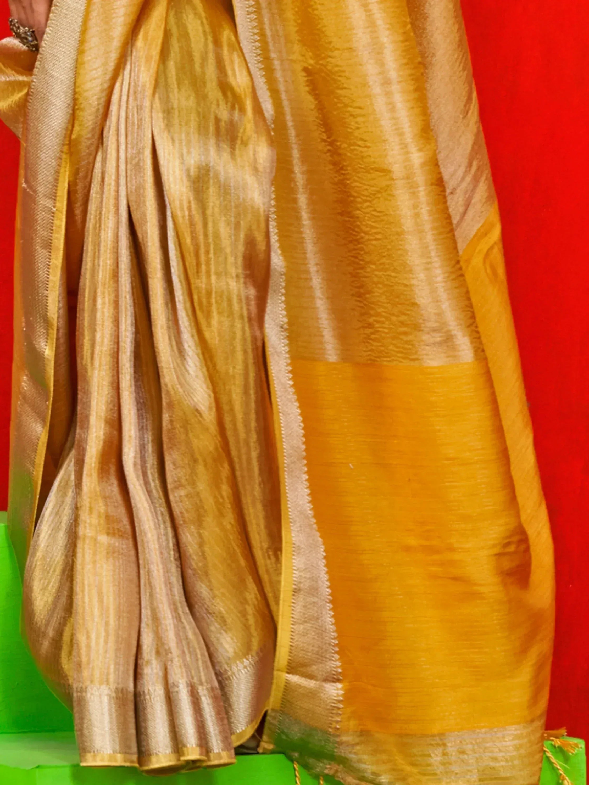 Golden yellow silk saree with woven stripes and zari border, ethnic Indian wear