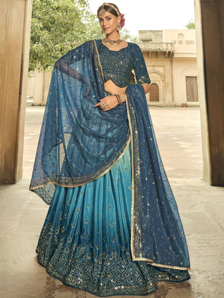 Blue embroidered lehenga choli with sheer dupatta, perfect for Indian weddings and festive occasions