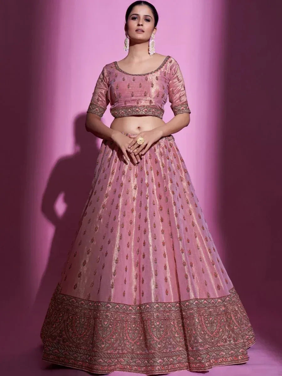 Pink embroidered lehenga choli with gold detailing, perfect for Indian weddings and festive occasions.