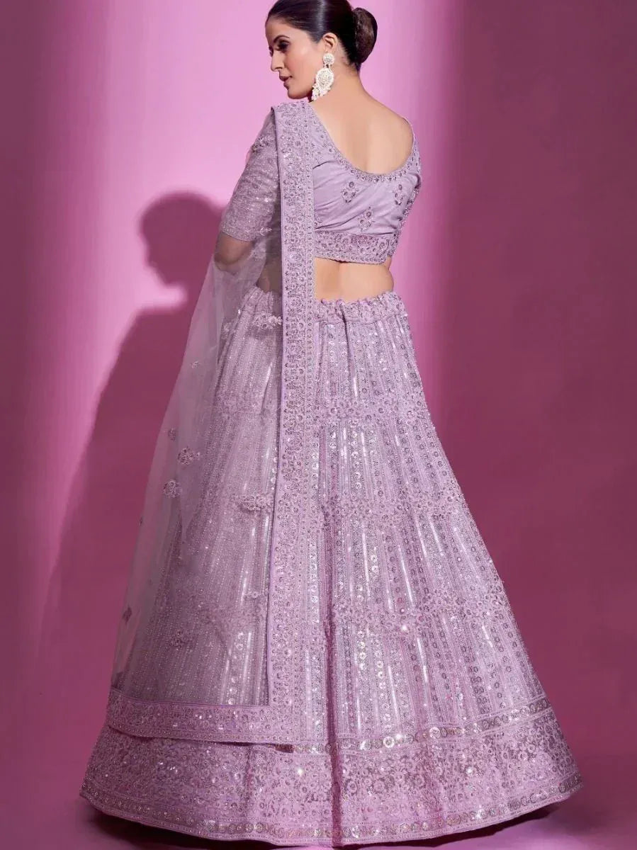 Lavender designer lehenga choli with intricate embroidery and sequin work, perfect for weddings and festive occasions.