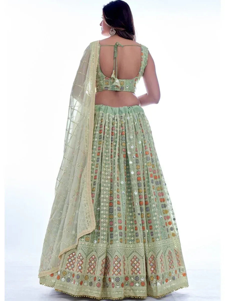 Mint green designer lehenga choli with floral embroidery and mirror work, back view
