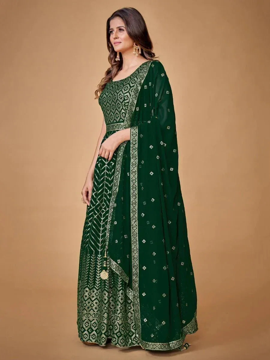Emerald green embroidered ethnic gown with geometric patterns, perfect for Indian occasions