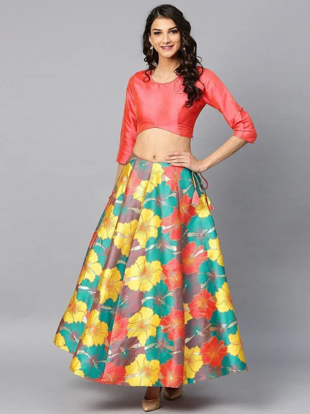 Vibrant floral lehenga with coral crop top, perfect for Indian ethnic wear occasions