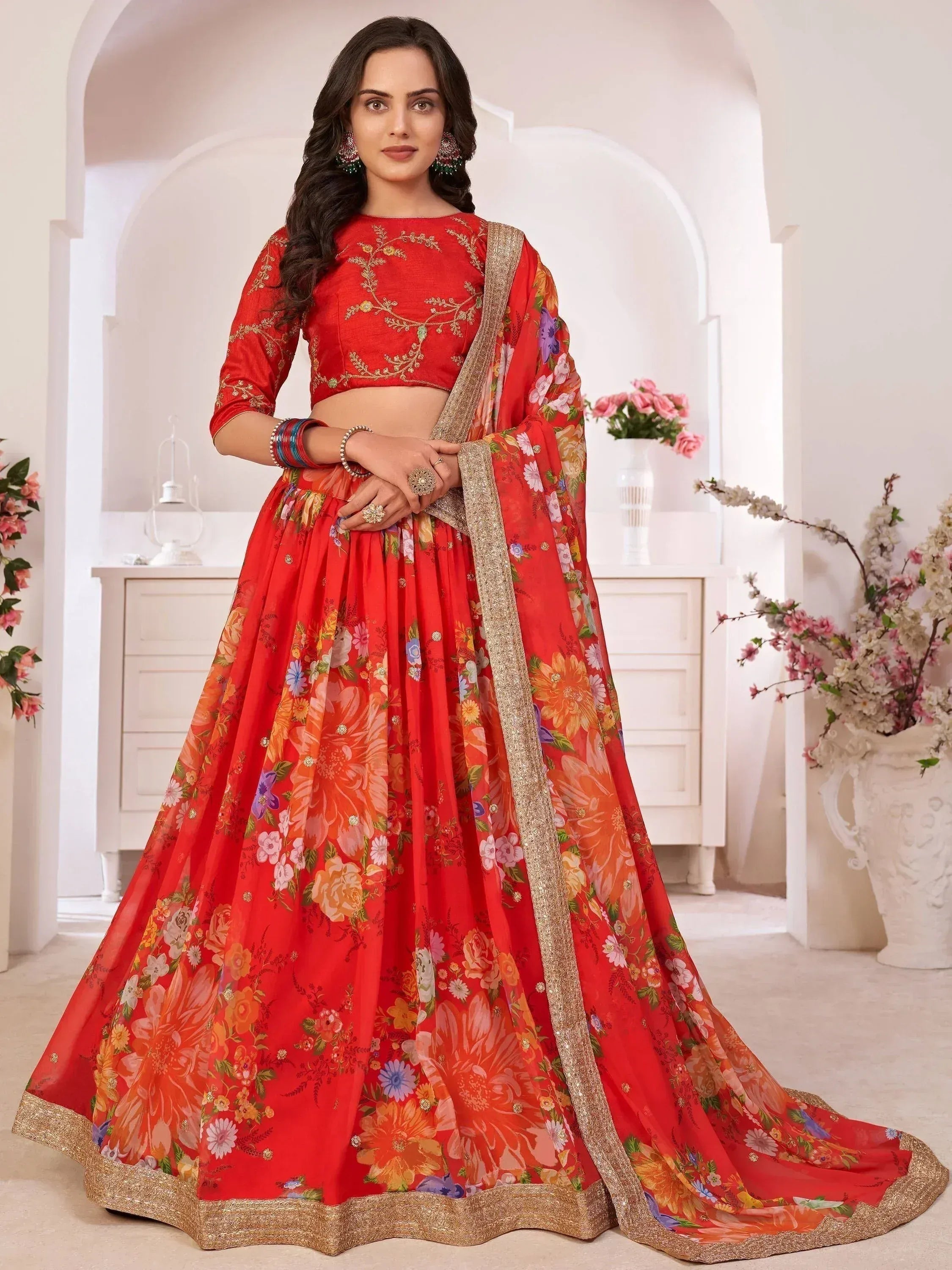 Red floral lehenga choli with gold embroidery, perfect for Indian weddings and festive occasions