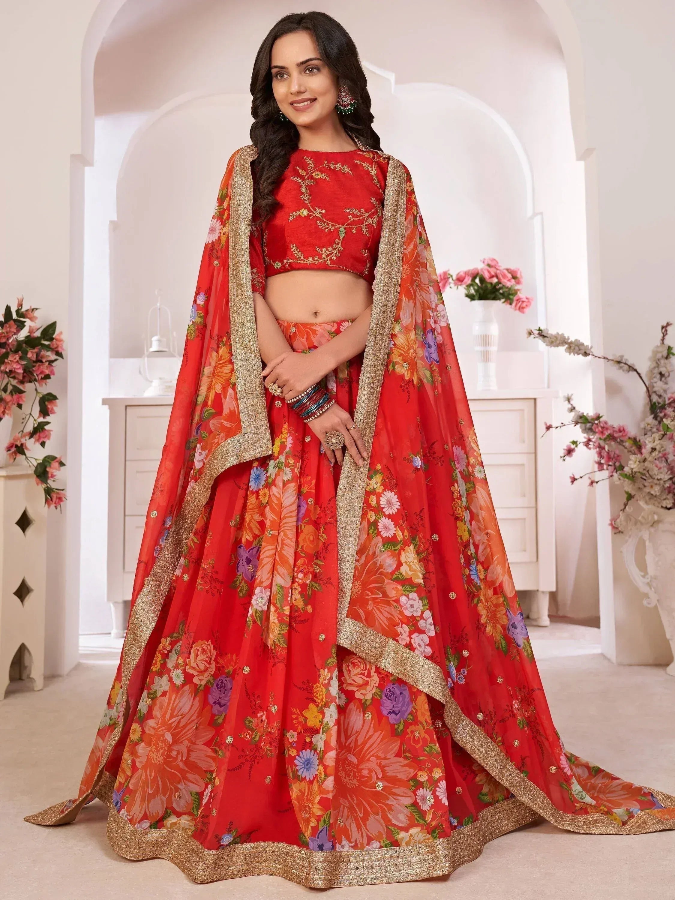 Red floral lehenga choli with gold embroidery, perfect for Indian weddings and festive occasions