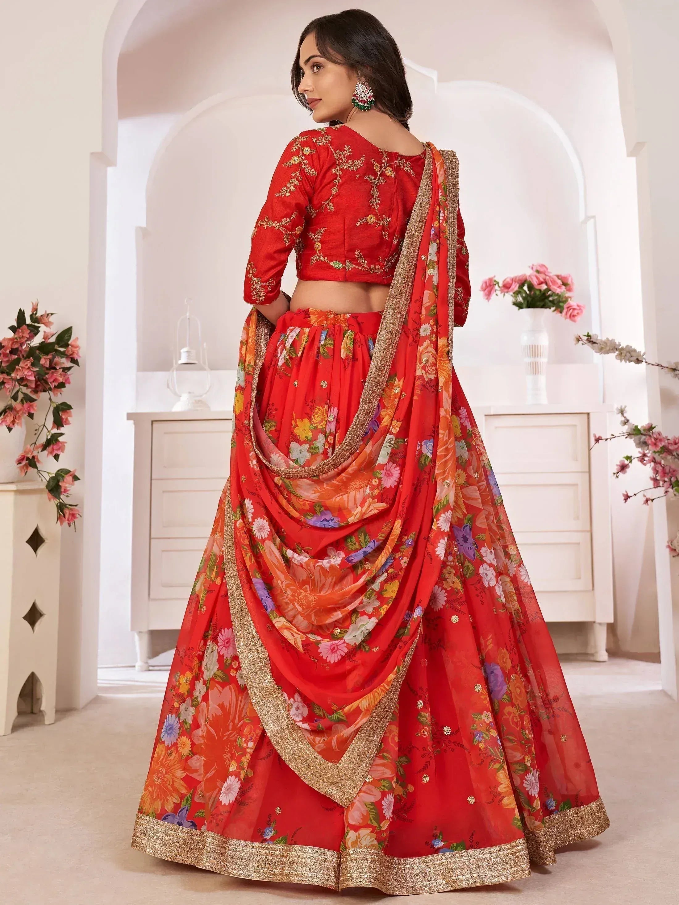 Red floral lehenga choli with gold embroidery, perfect for Indian weddings and festive occasions