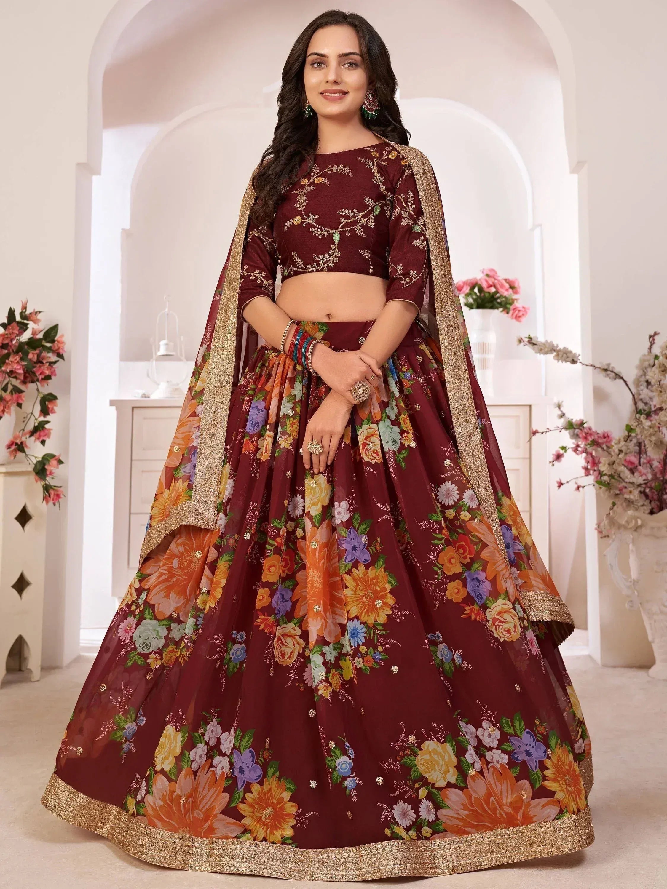 Maroon floral lehenga choli with gold embroidery, perfect for Indian ethnic wear and festive occasions.