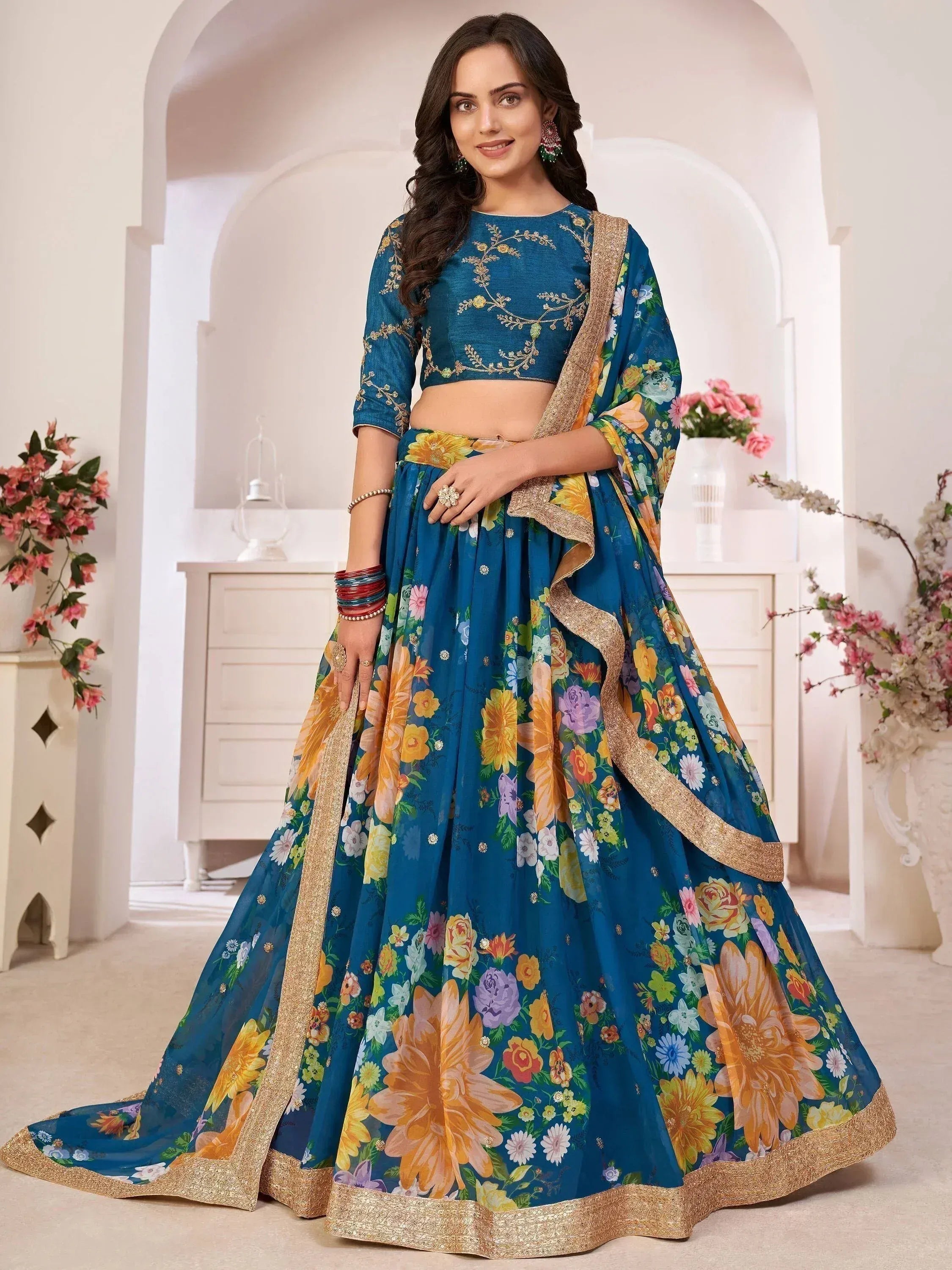 Blue floral print lehenga choli with gold embroidery, perfect for Indian ethnic wear occasions