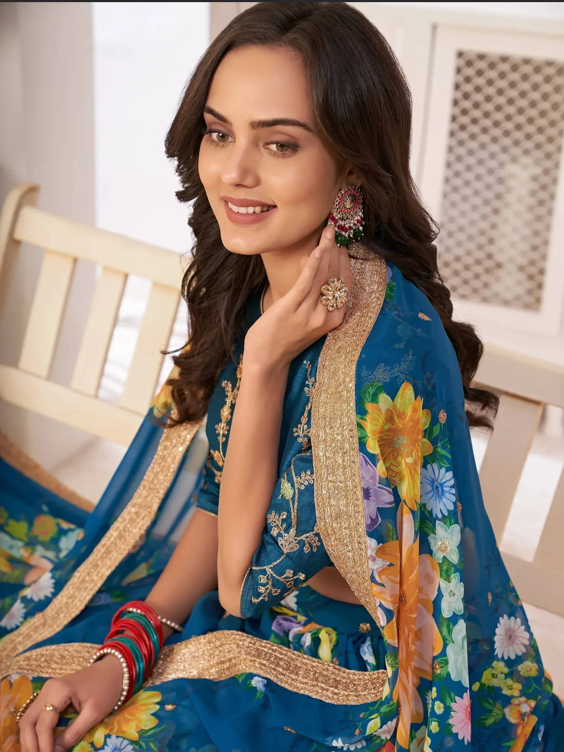 Blue floral ethnic saree with gold embroidery, perfect for Indian occasions and festivals.