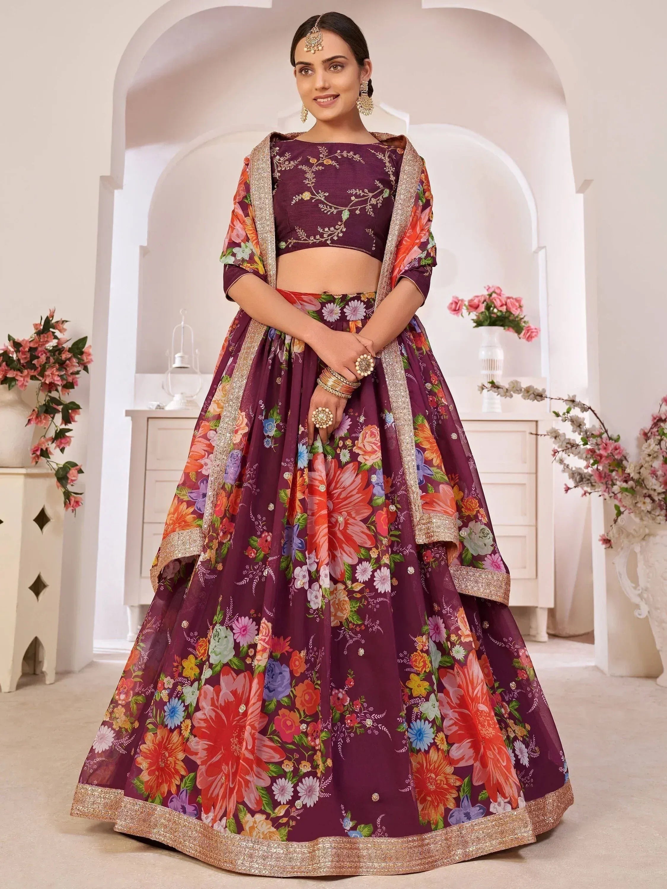 Purple floral lehenga choli with gold embroidery, perfect for Indian weddings and festive occasions