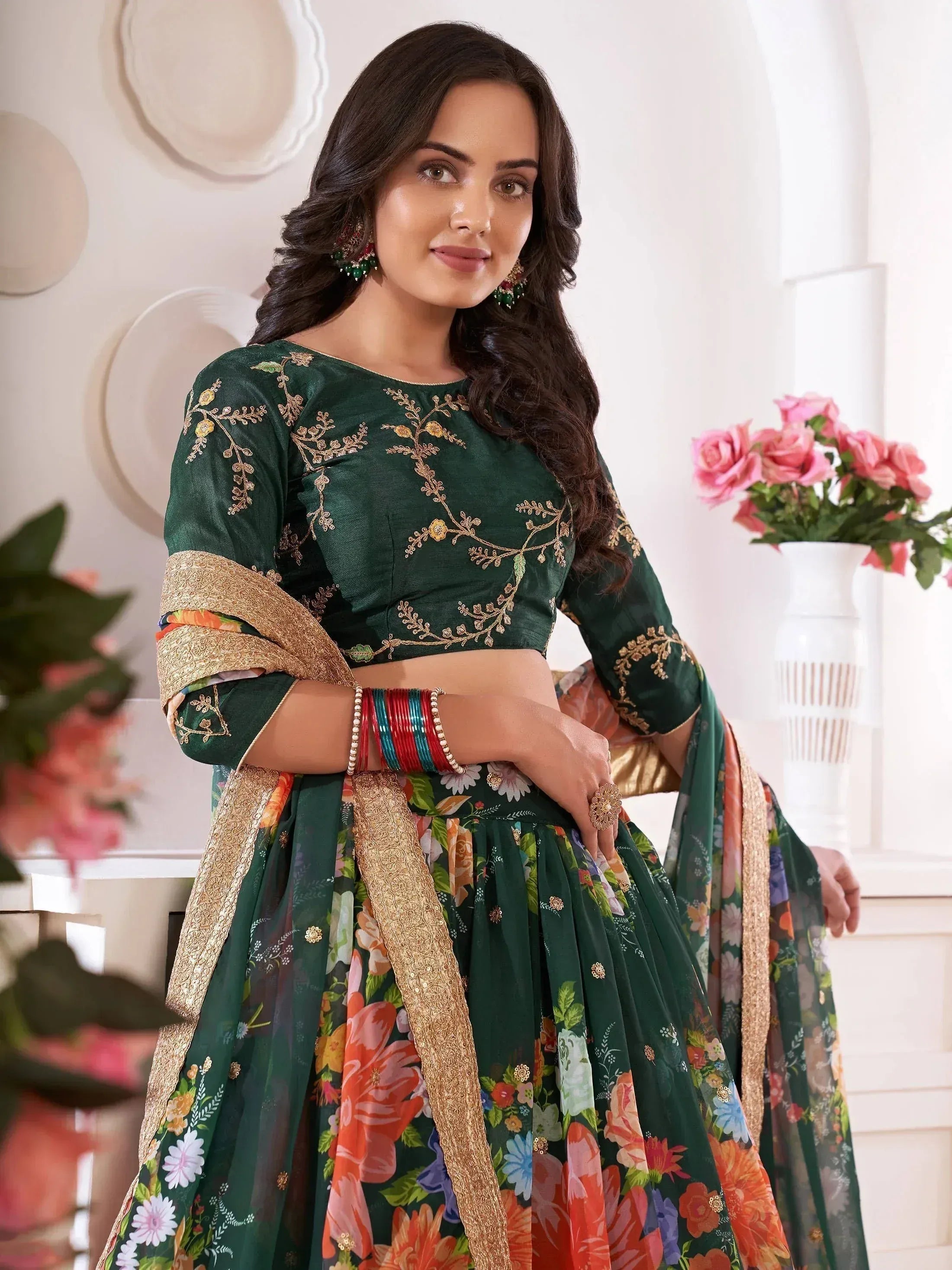 Green floral embroidered lehenga choli with gold detailing, perfect for Indian ethnic occasions
