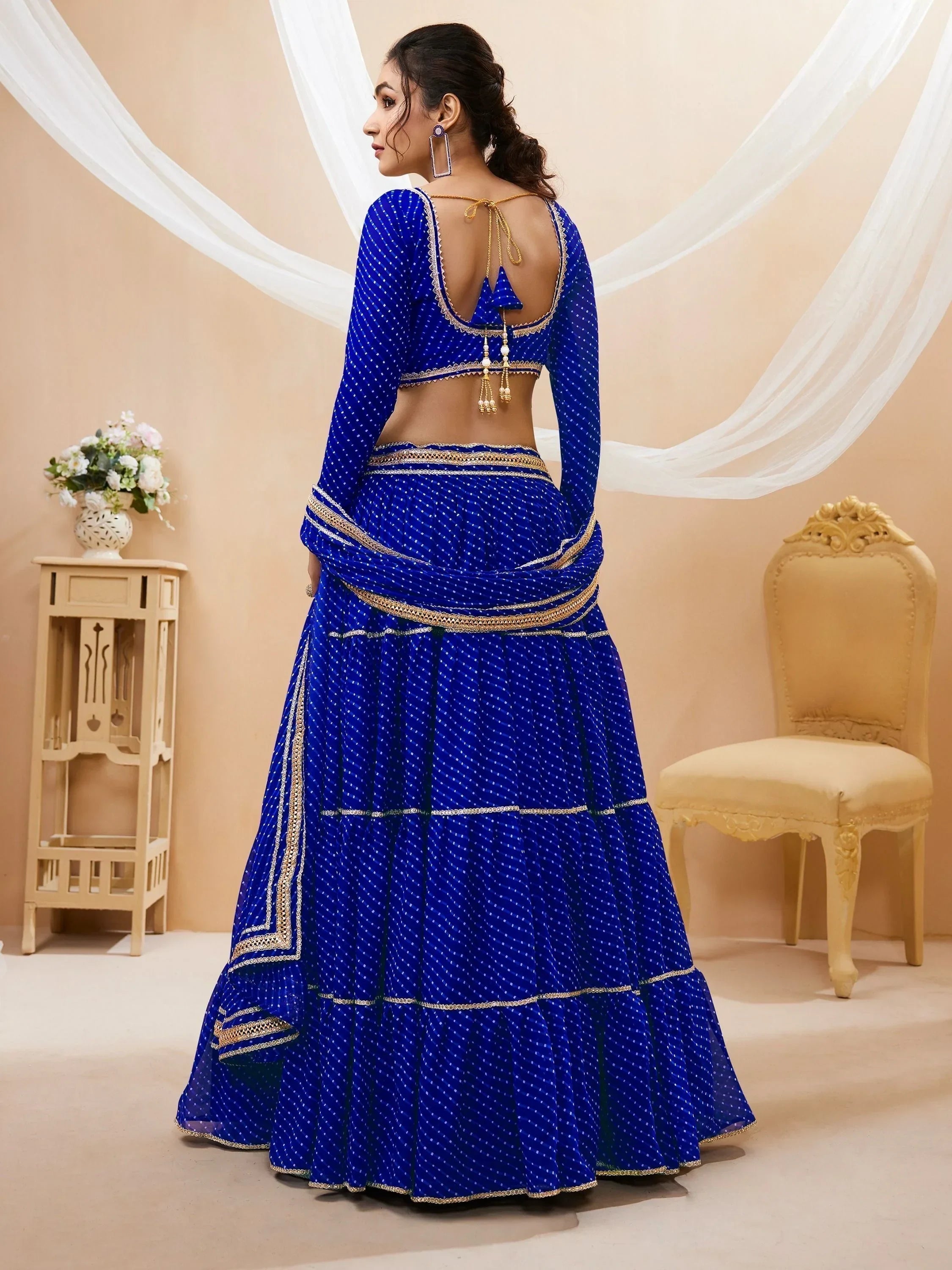 Royal blue designer lehenga choli with gold embroidery, backless blouse, and polka dot print for Indian ethnic wear