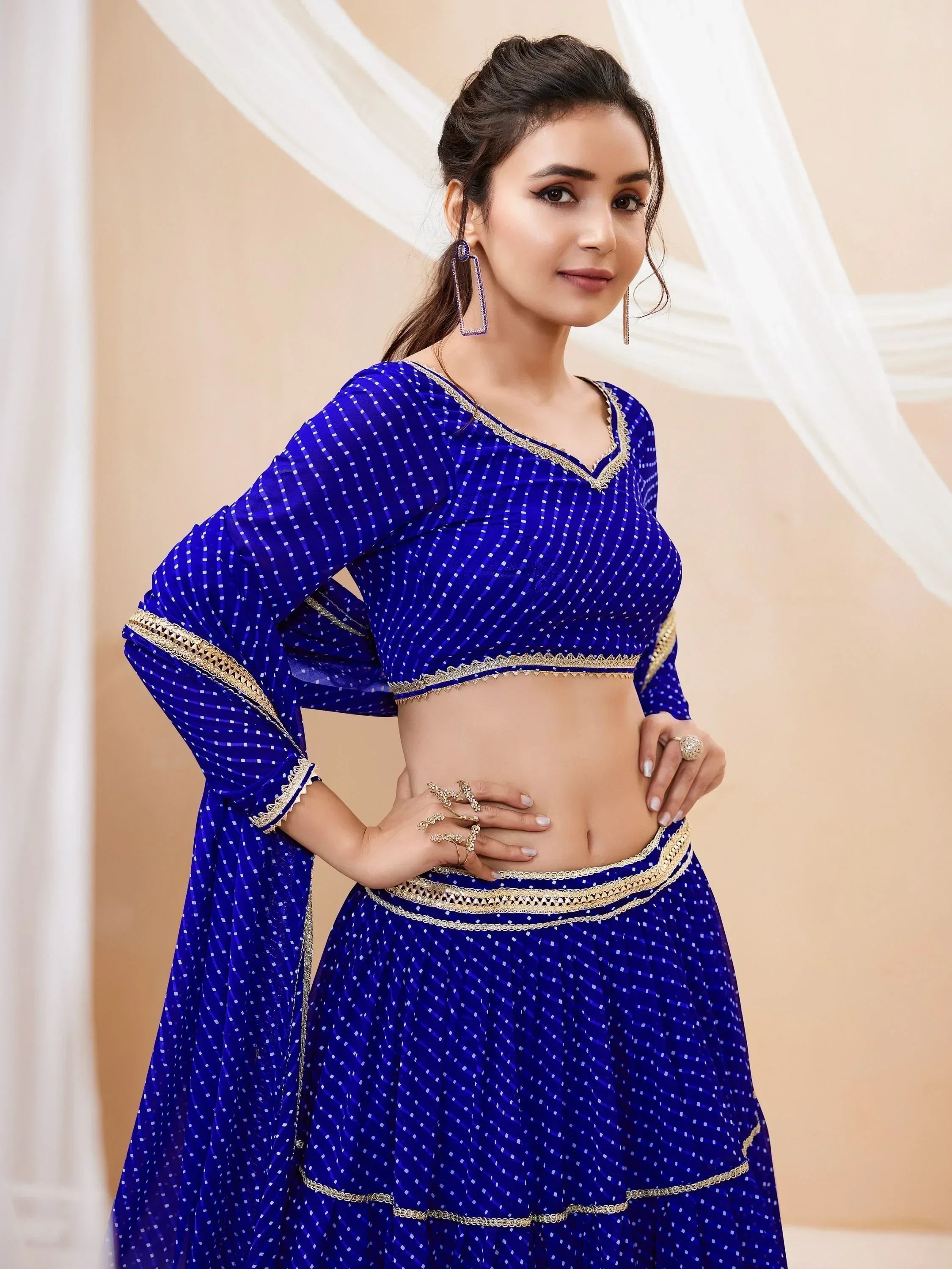 Royal blue ethnic lehenga choli with gold embroidery, perfect for Indian weddings and festive occasions