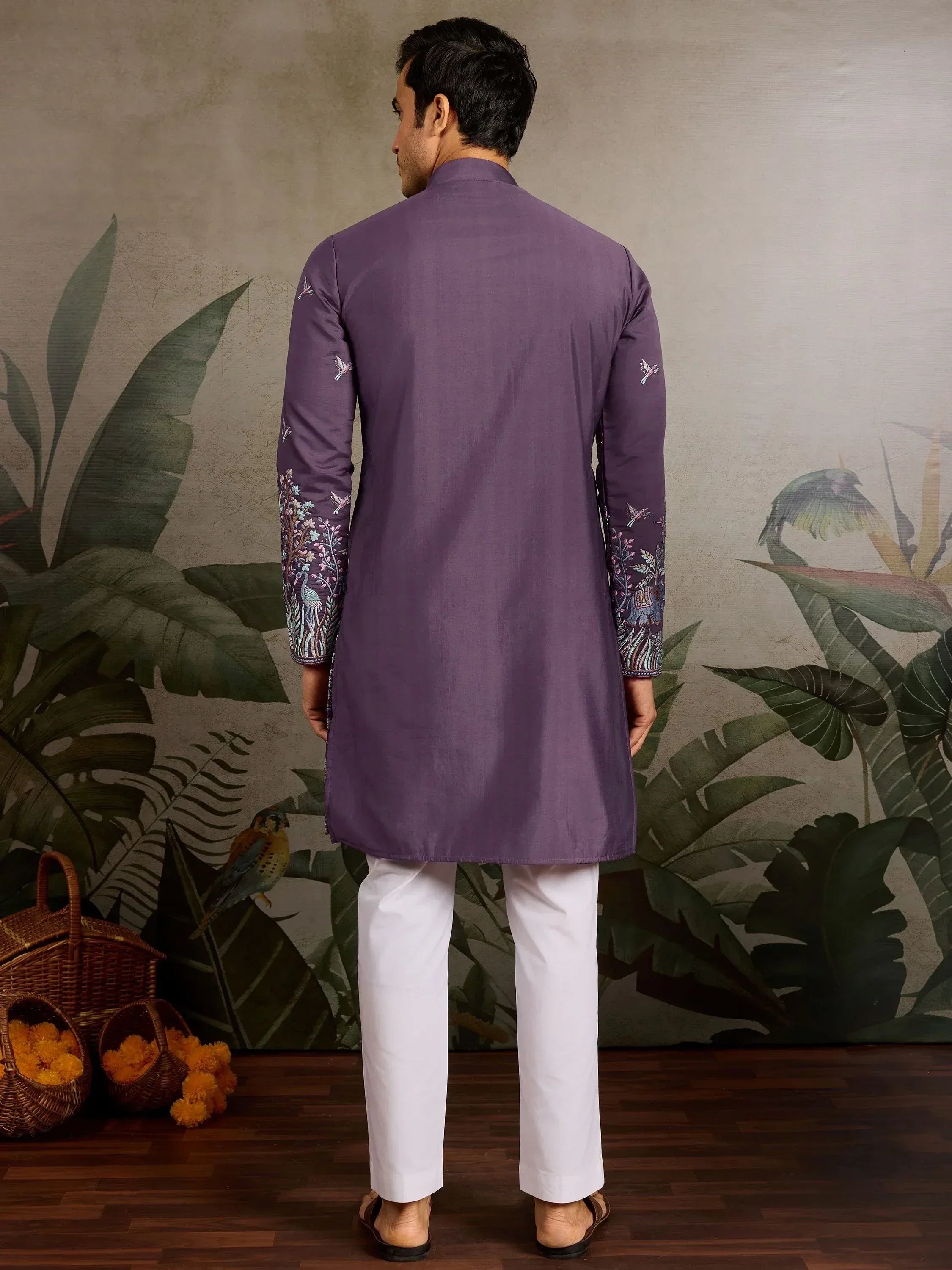 Purple embroidered kurta with floral and bird motifs, paired with white pants, ideal for ethnic occasions.