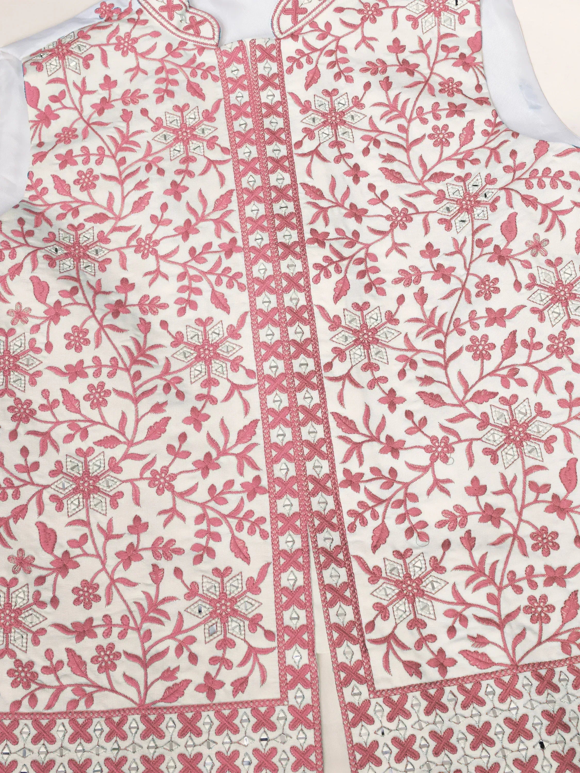 White ethnic top with pink floral embroidery and mirror work, perfect for Indian wear