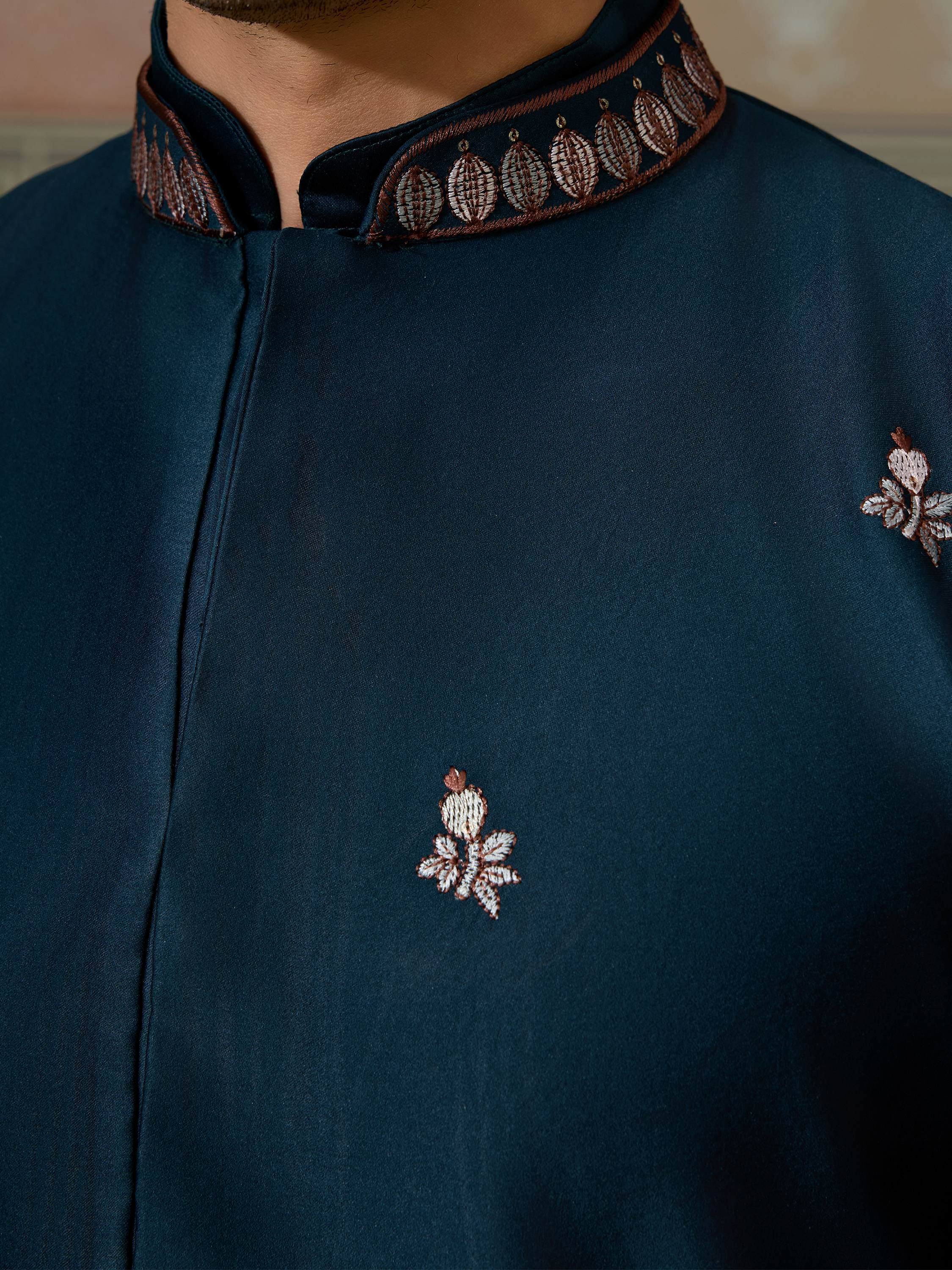 Dark teal men's kurta with intricate brown and silver embroidery on collar and chest, ethnic wear