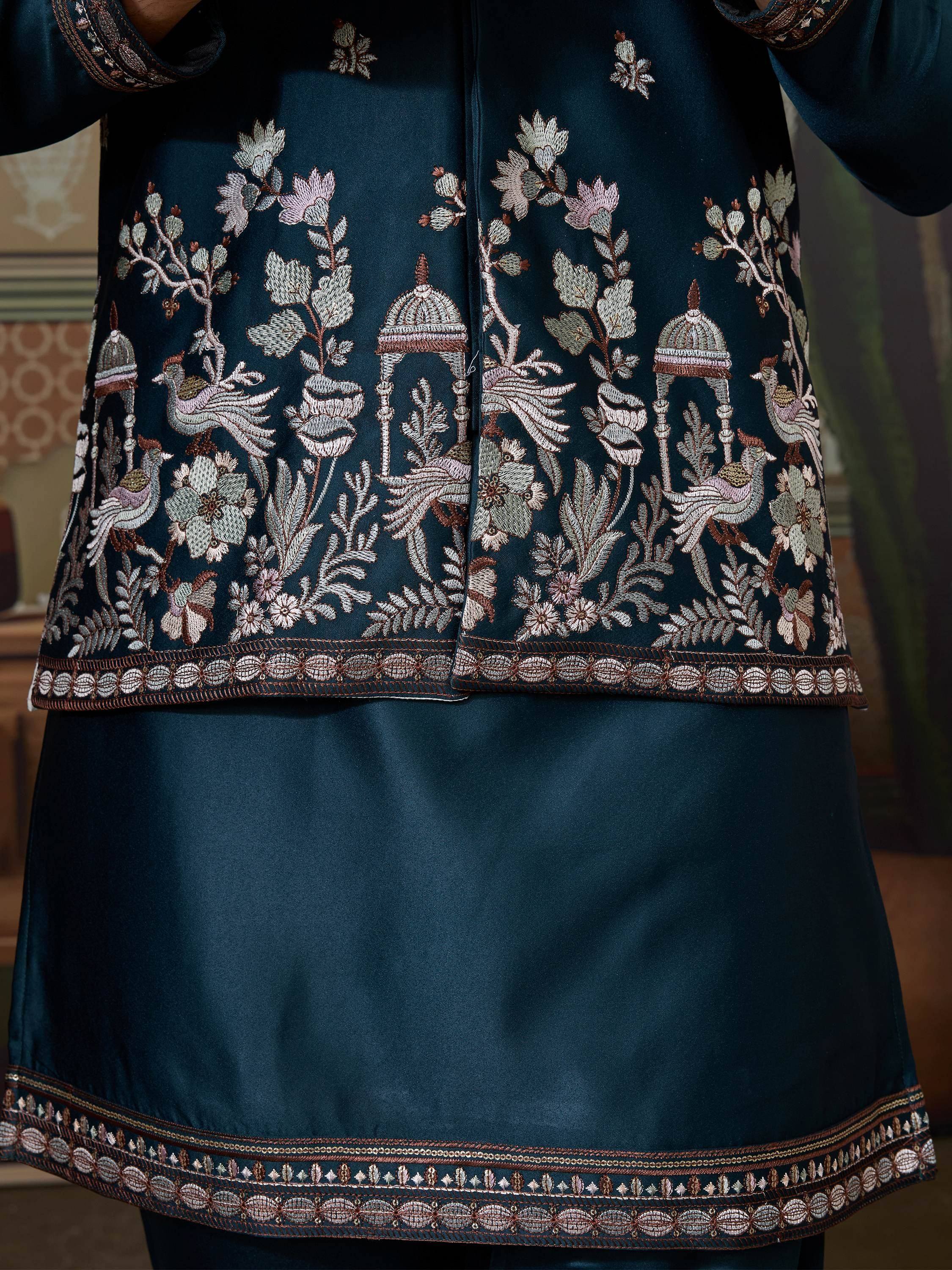 Dark teal ethnic kurta with intricate floral and bird embroidery, perfect for Indian festive wear.
