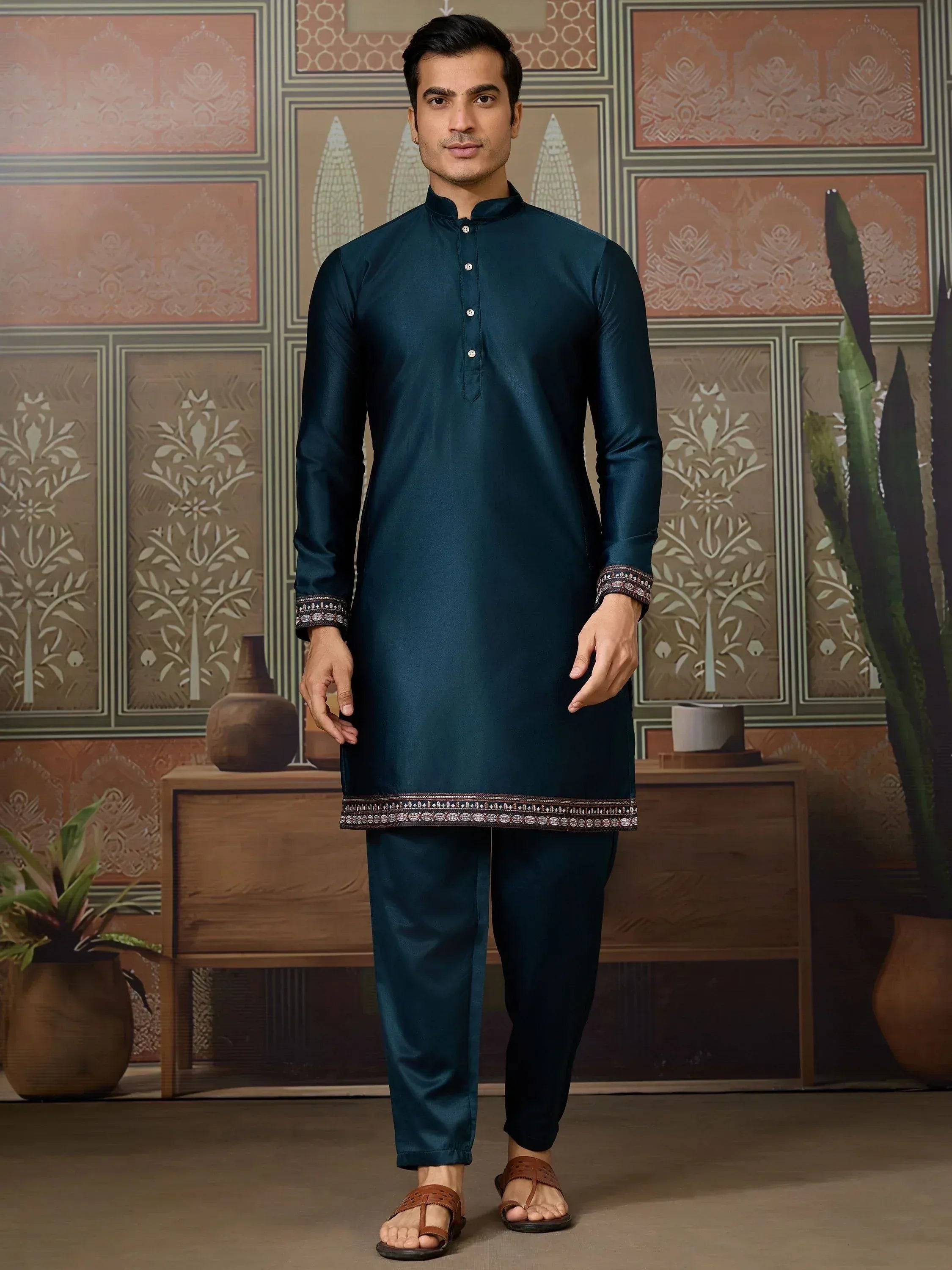 Men's teal ethnic kurta set with embroidered hem and cuffs, perfect for Indian festive occasions