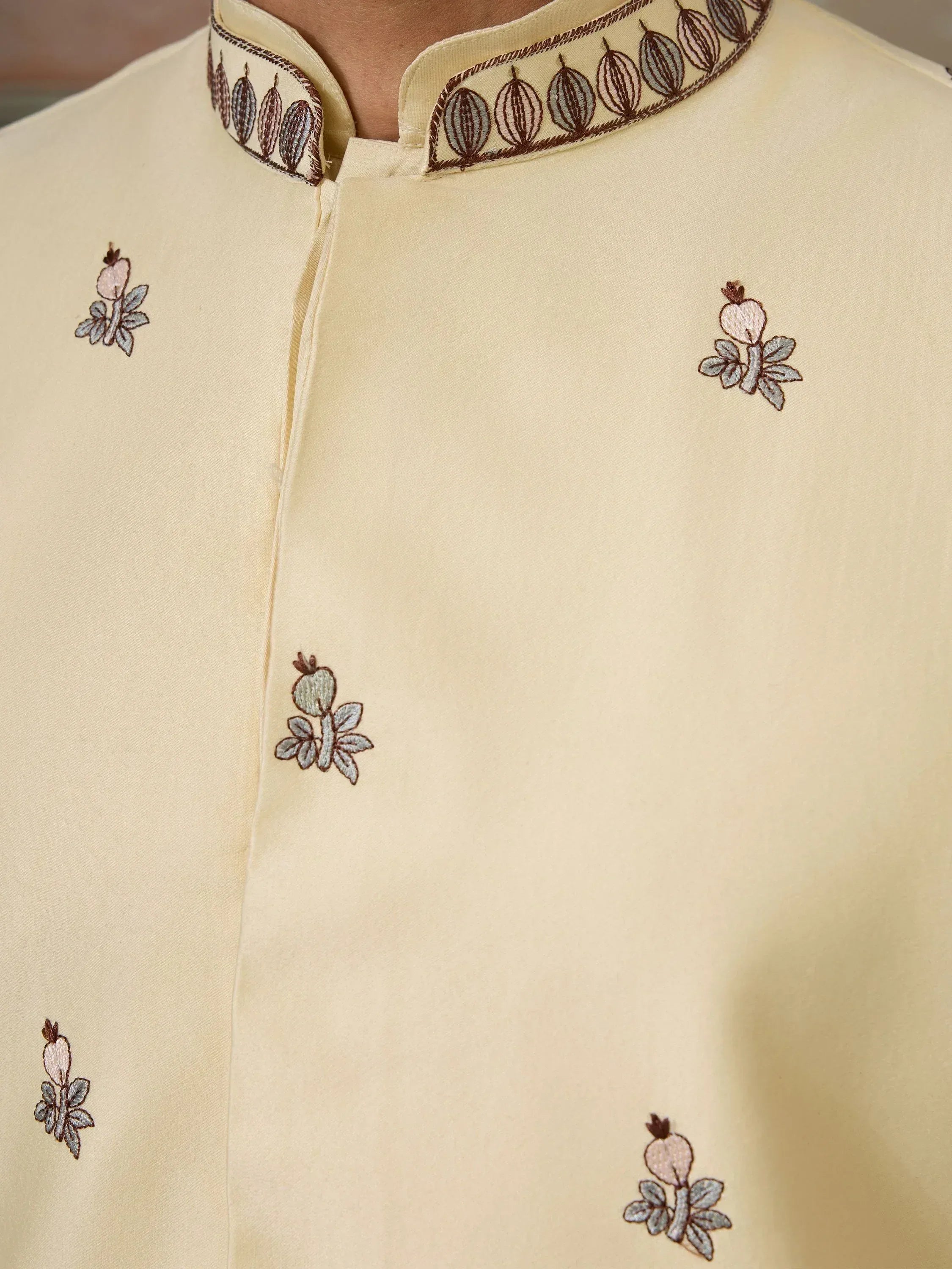 Cream ethnic kurta with floral embroidery and detailed collar design for men