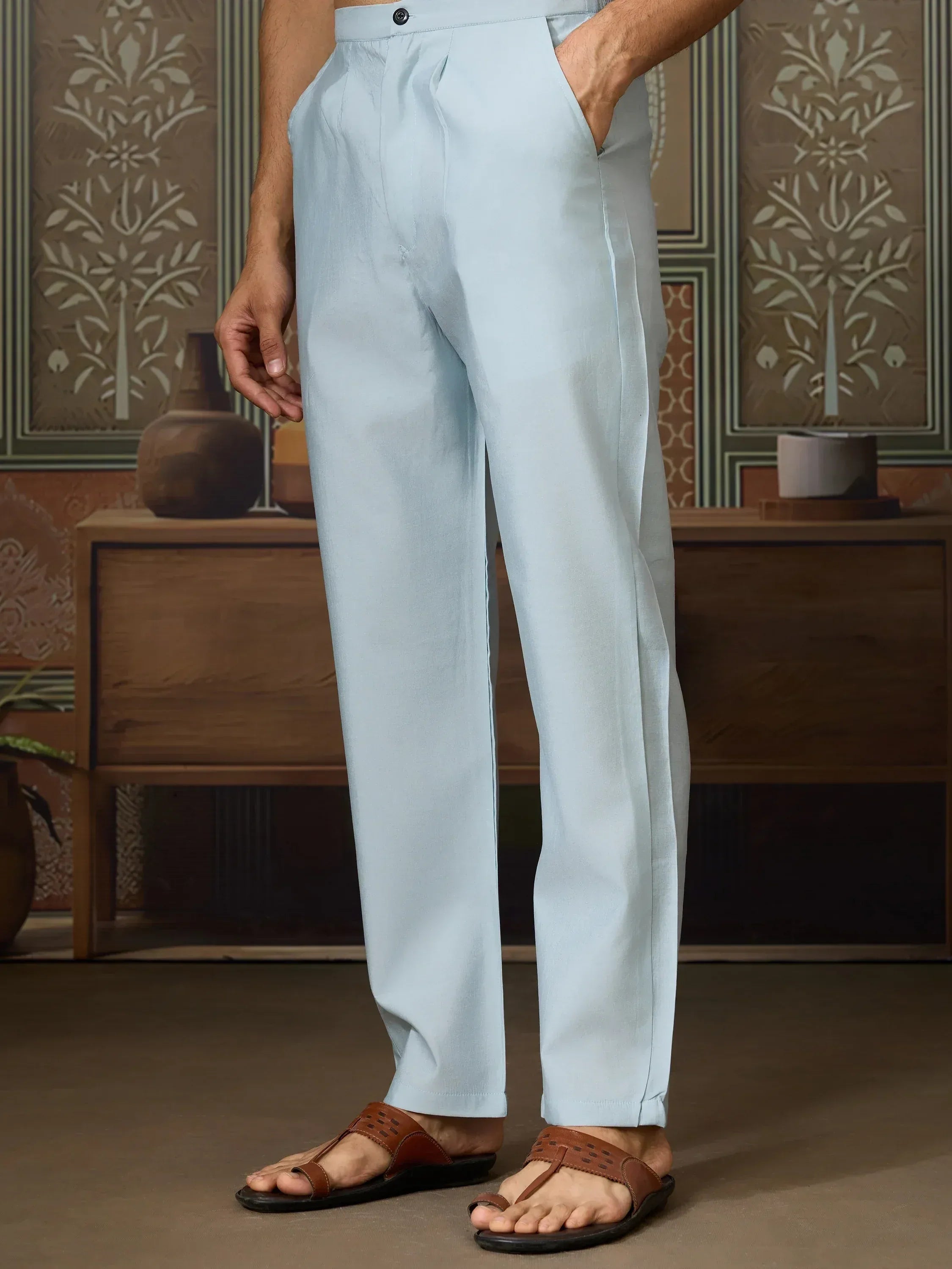 Light blue ethnic trousers with pleats, paired with brown sandals, ideal for Indian festive wear