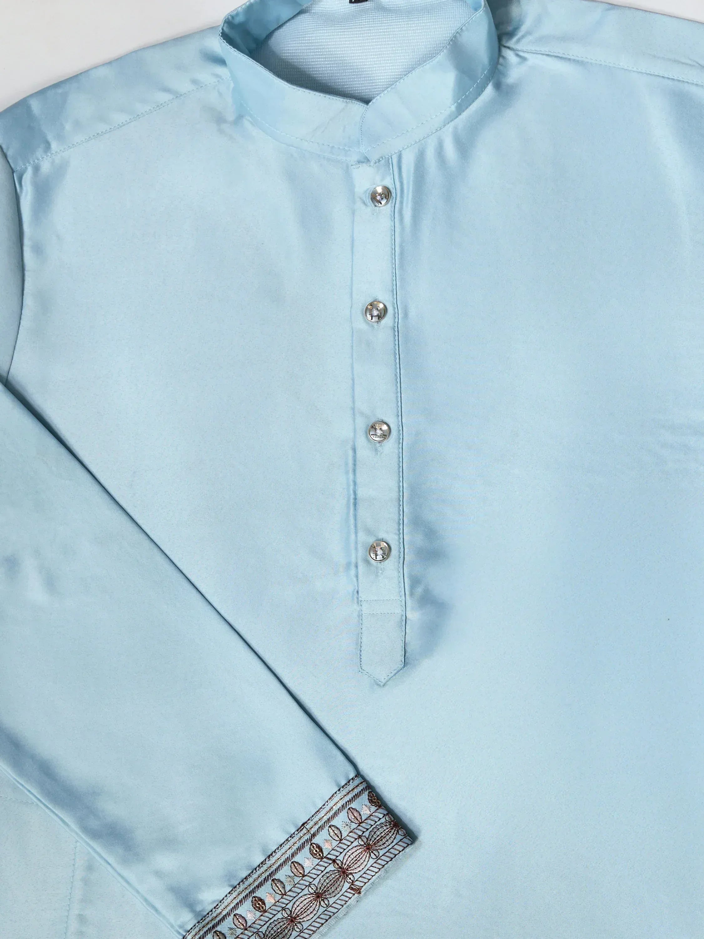 Light blue men's kurta with embroidered hem and silver buttons, ethnic wear for festive occasions