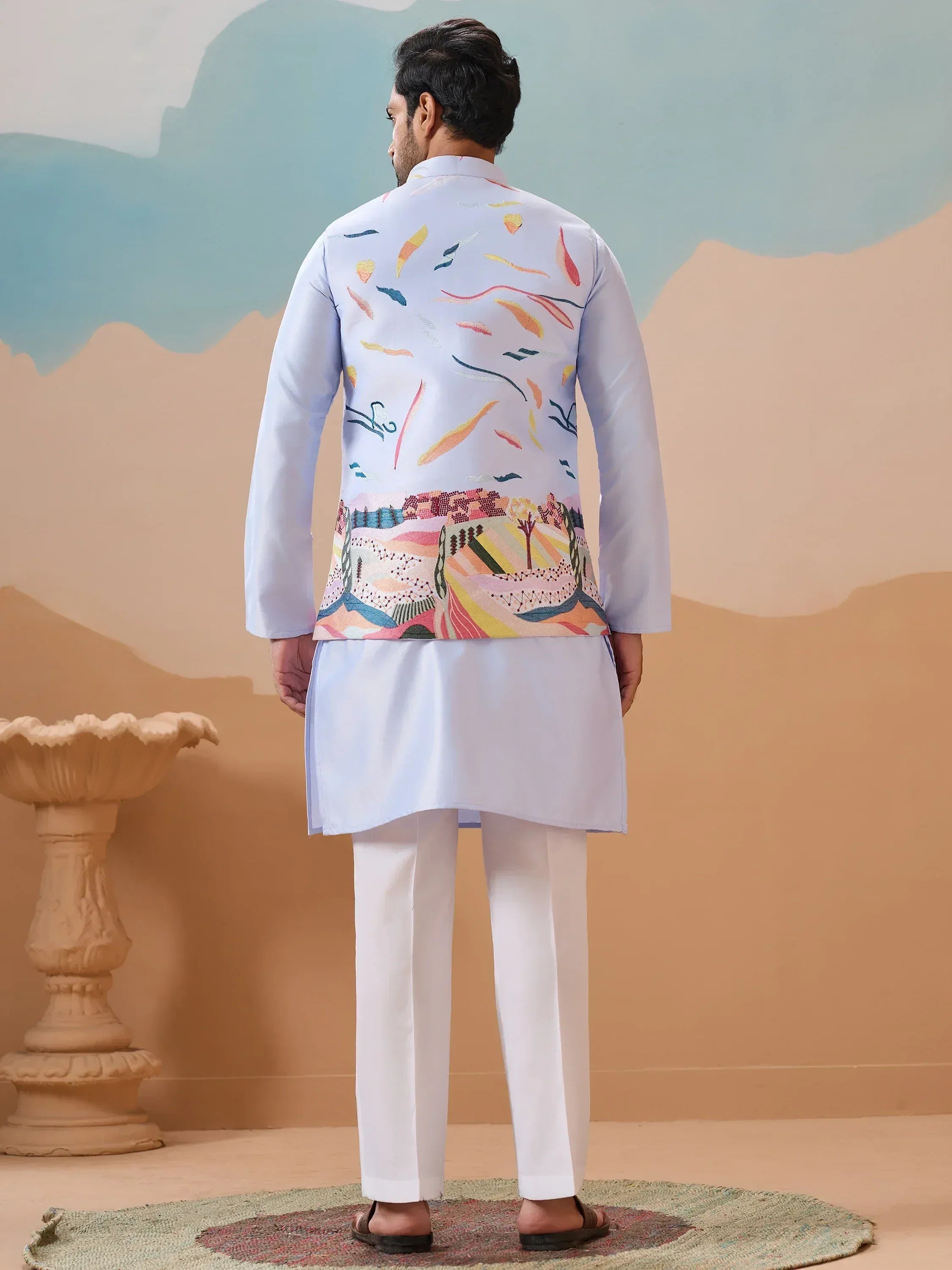 Men's embroidered kurta set with colorful abstract print, ideal for Indian ethnic occasions