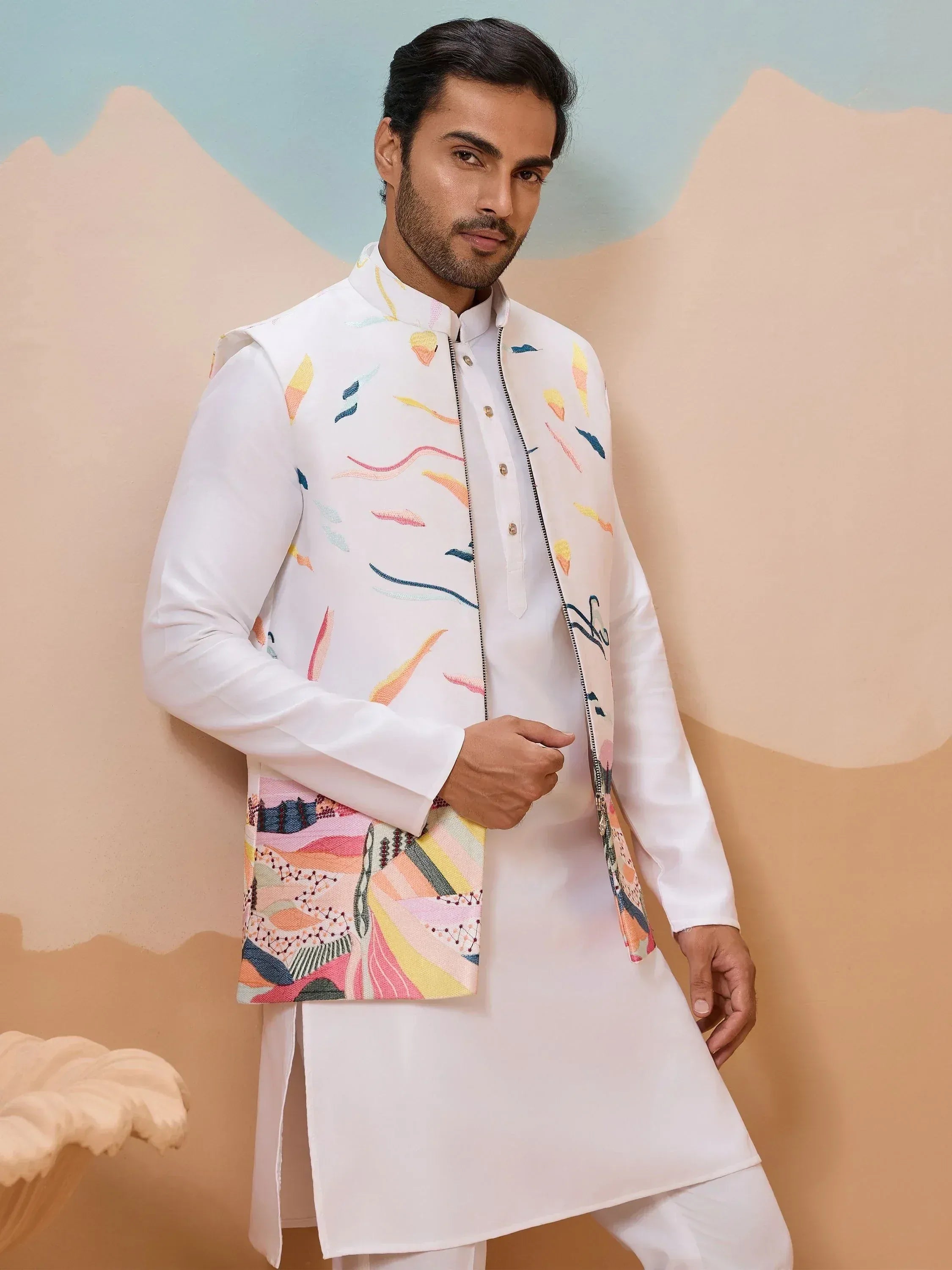 Man in white kurta with colorful embroidered Nehru jacket, Indian ethnic wear