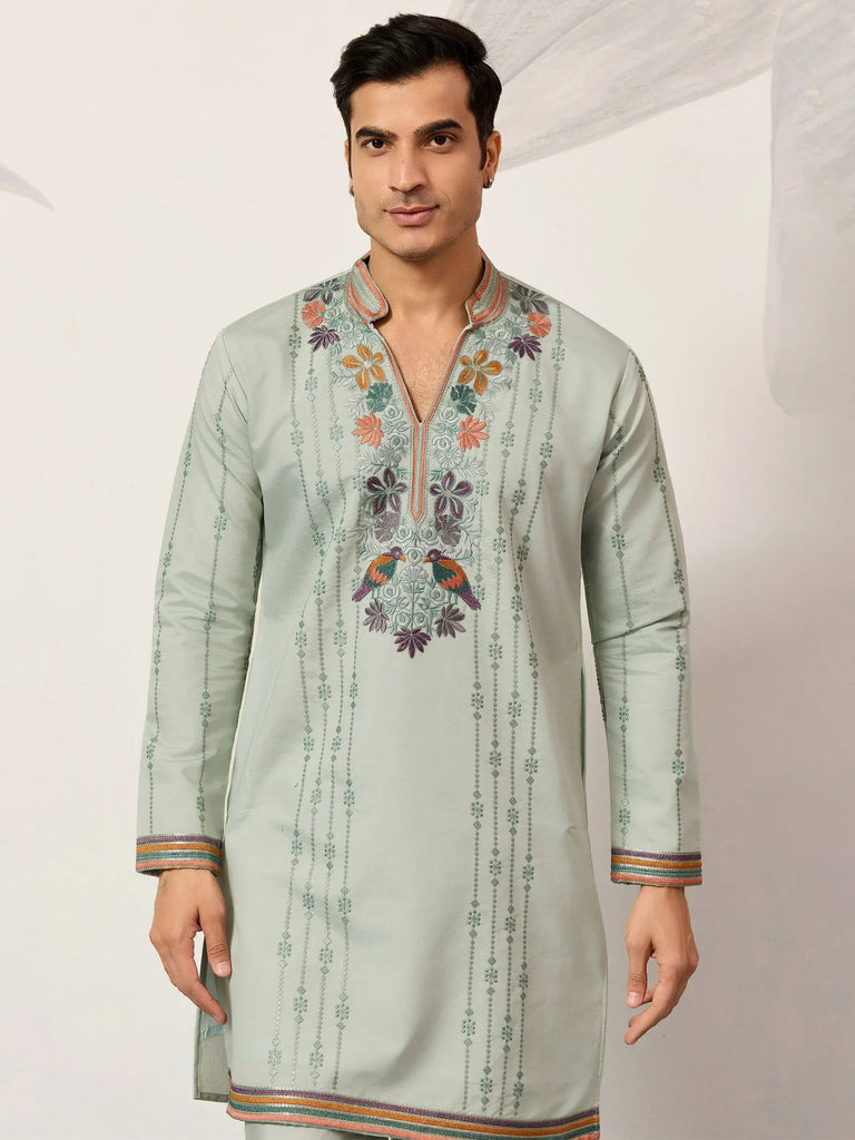 Men's light green kurta with floral and bird embroidery, perfect for ethnic occasions