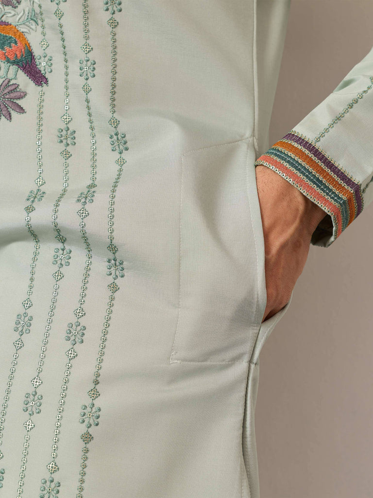 Light green ethnic kurta with floral embroidery and colorful striped cuffs