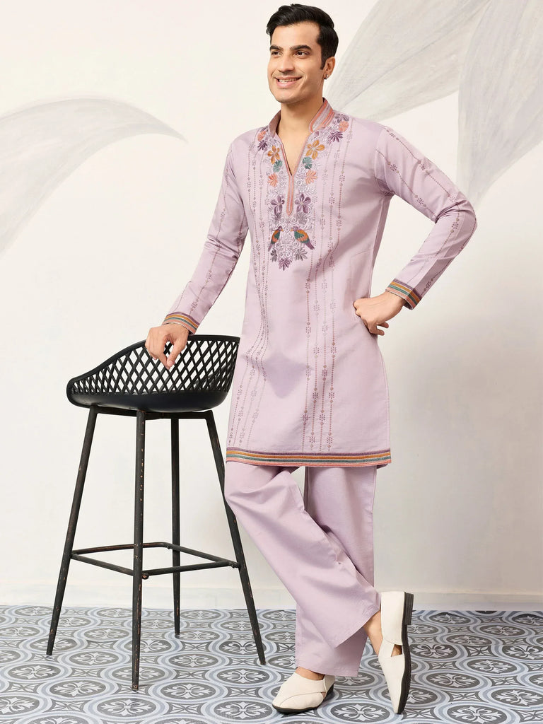Men's lavender kurta set with floral embroidery, perfect for Indian ethnic wear occasions.