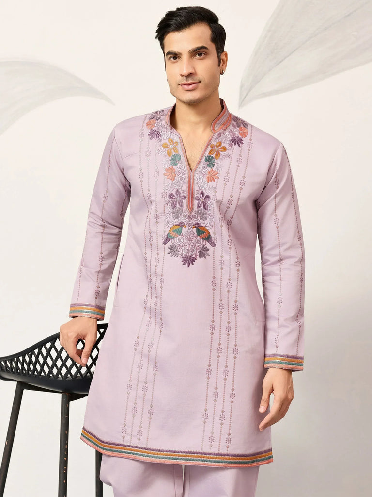 Men's lavender kurta with floral embroidery and colorful trim, perfect for ethnic occasions