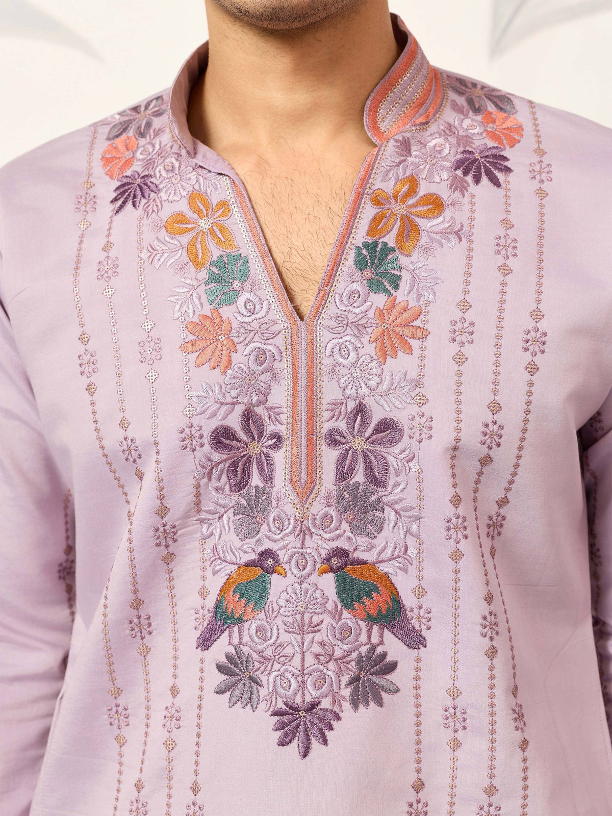 Lavender kurta with intricate floral and bird embroidery, perfect for ethnic occasions.