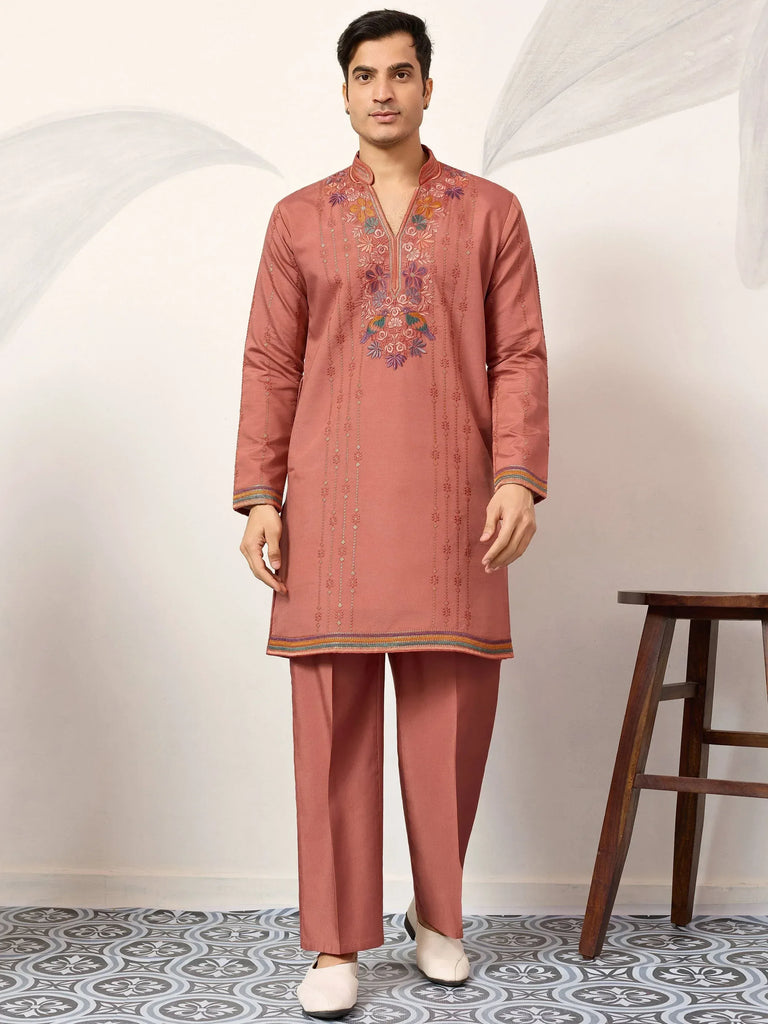 Men's embroidered kurta set in dusty rose with floral detailing, perfect for ethnic occasions