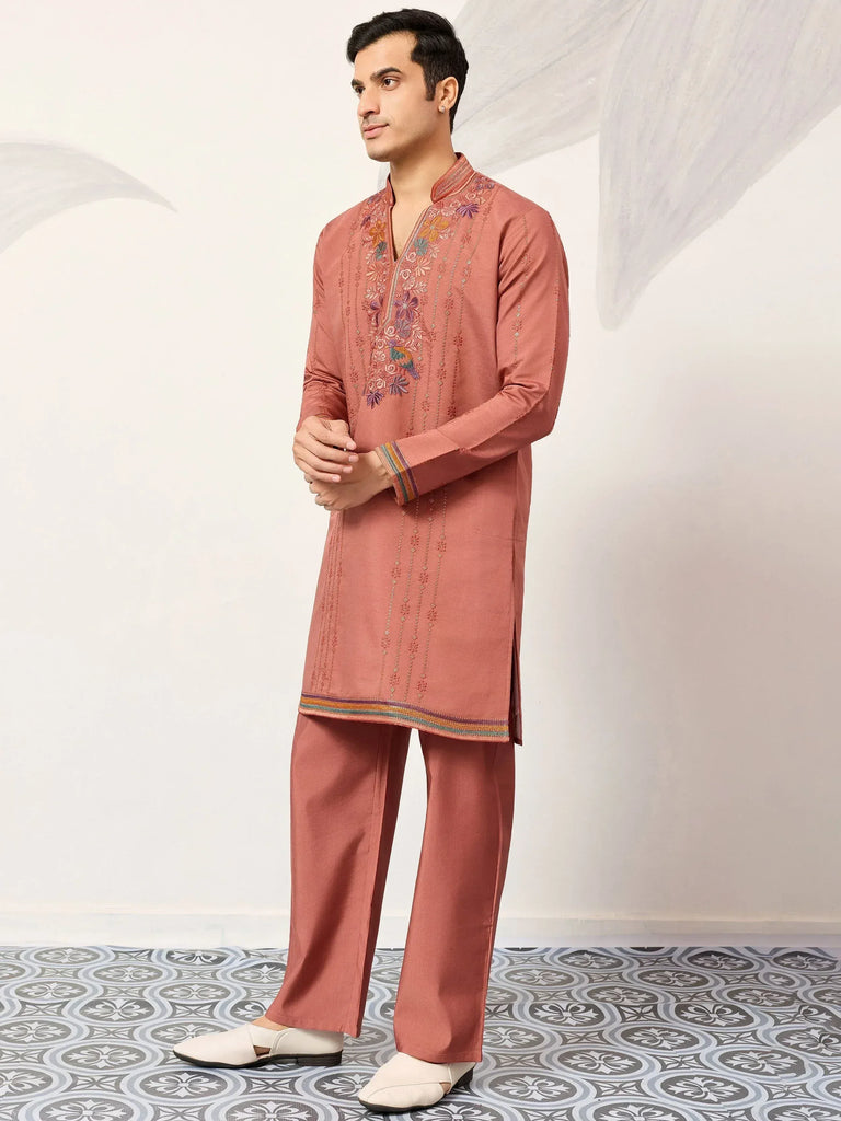 Men's embroidered kurta set in dusty rose with floral detailing and matching pants