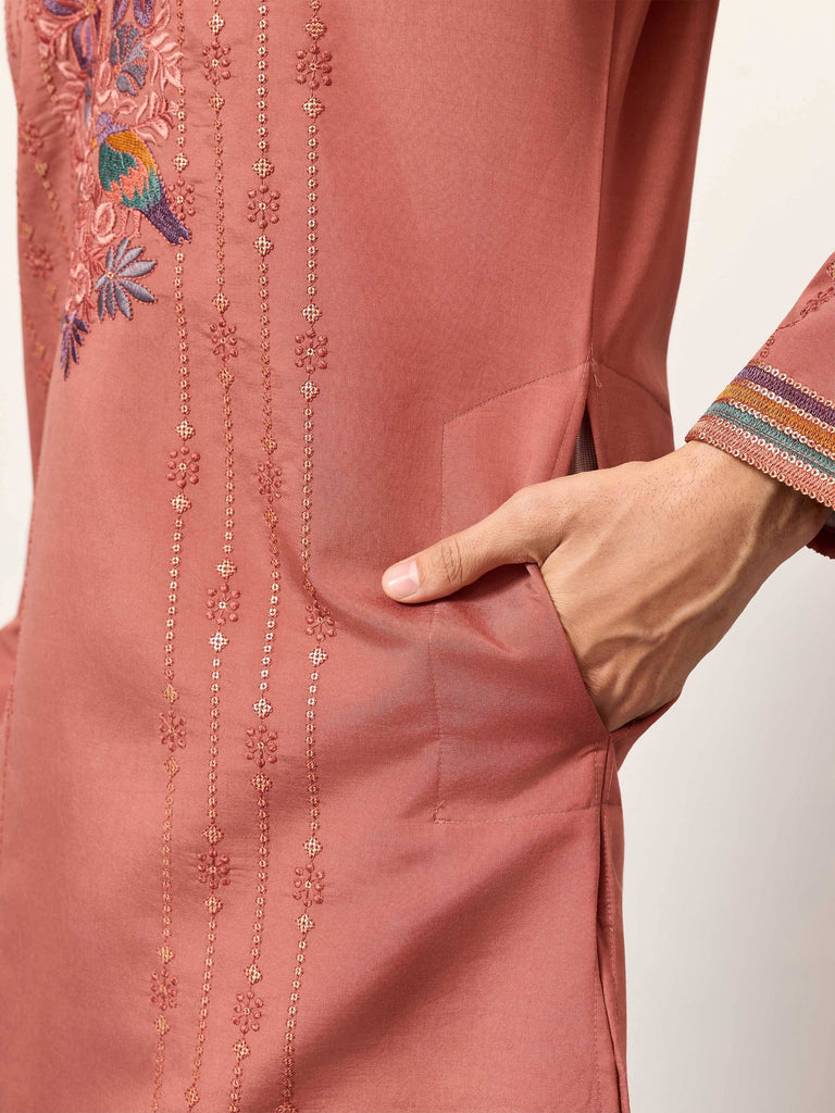 Dusty pink embroidered kurta with floral and bird motifs, detailed sleeve trim, and side pocket