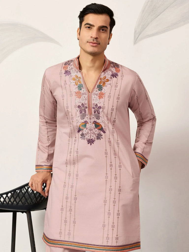 Pink embroidered kurta with floral and bird motifs, perfect for ethnic wear occasions.