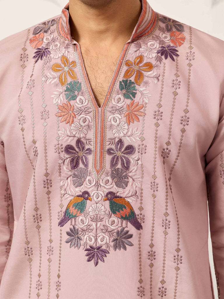 Pink embroidered kurta with floral and bird motifs, perfect for ethnic wear occasions.