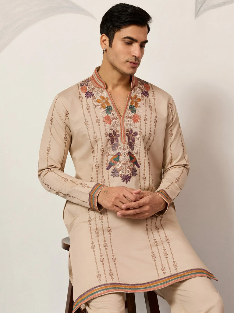 Beige embroidered kurta with floral and bird motifs, perfect for Indian ethnic wear occasions