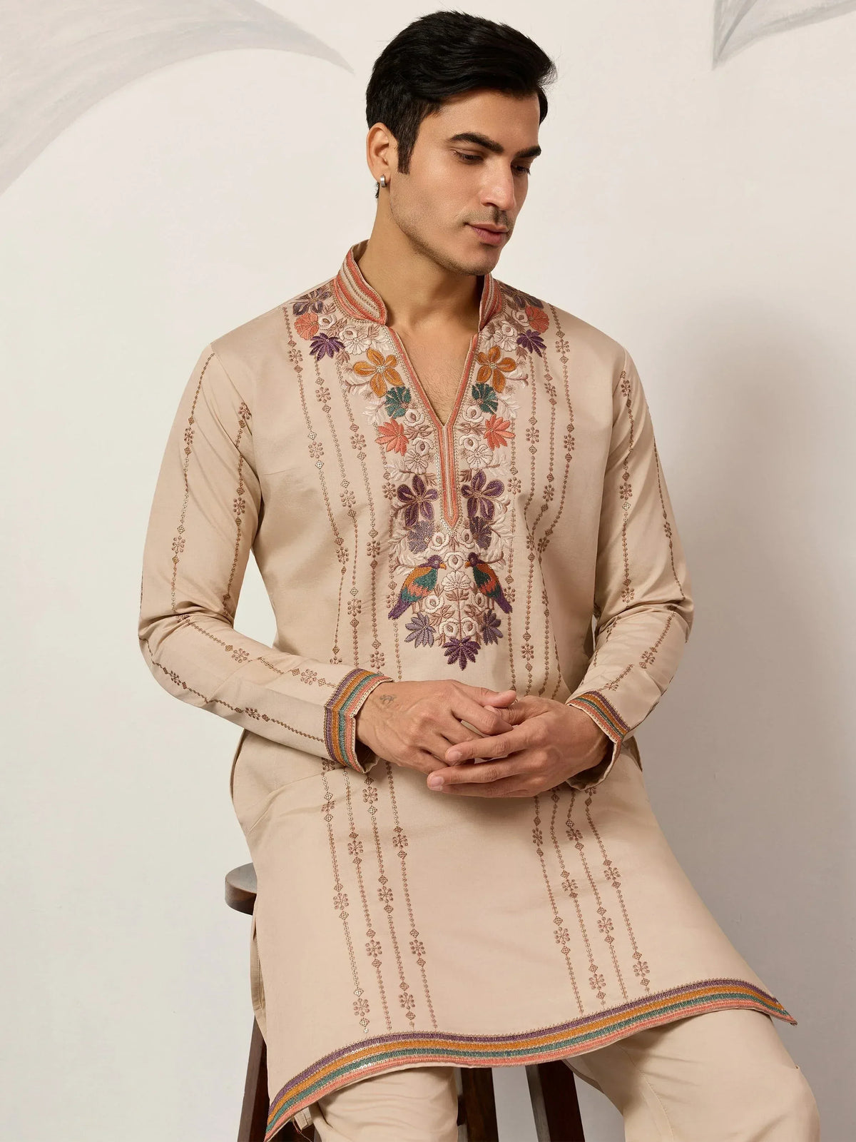 Beige embroidered kurta with floral and bird motifs, perfect for Indian ethnic wear occasions