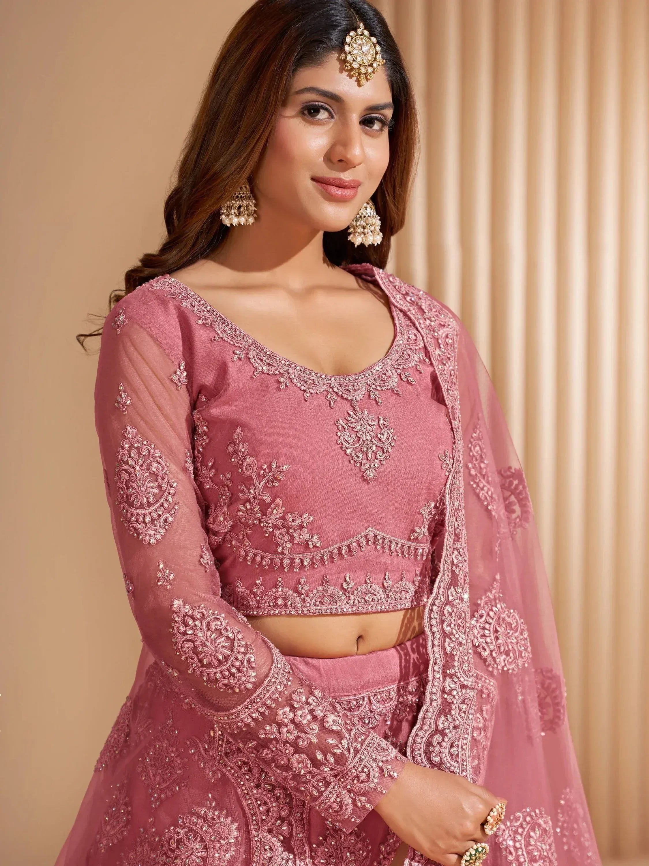 Pink embroidered lehenga choli with sheer dupatta, perfect for Indian ethnic wear and festive occasions