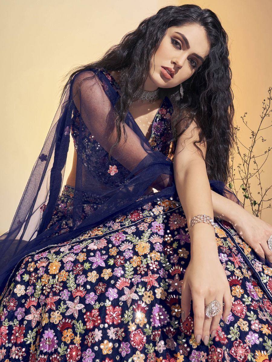 Elegant navy blue lehenga choli with floral embroidery and sheer dupatta, perfect for Indian ethnic wear occasions
